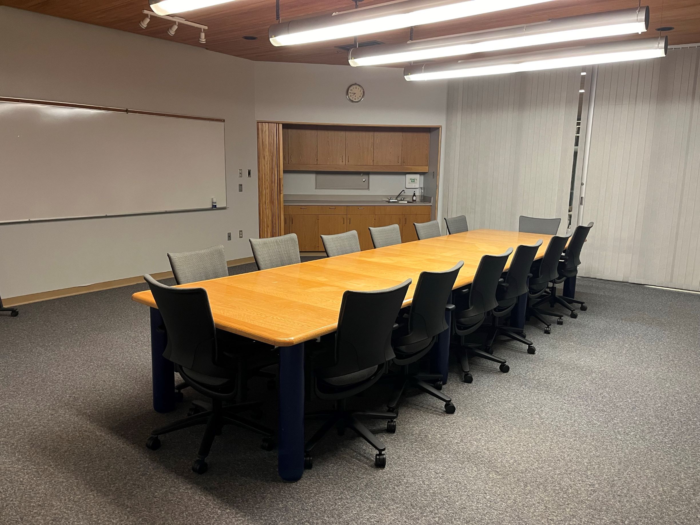 Boardroom with conference table and chairs.